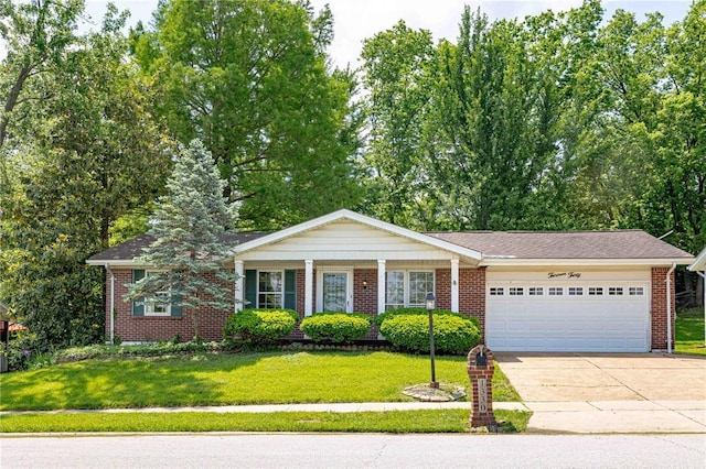 ranch-style house featuring a garage, concrete driveway, a front yard, and brick siding