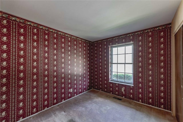 unfurnished room with carpet flooring