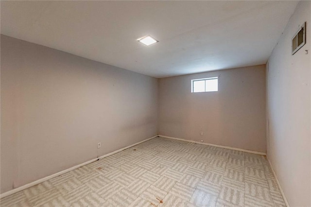 empty room with baseboards