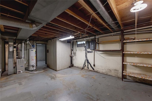 unfinished basement with water heater, electric panel, and heating unit