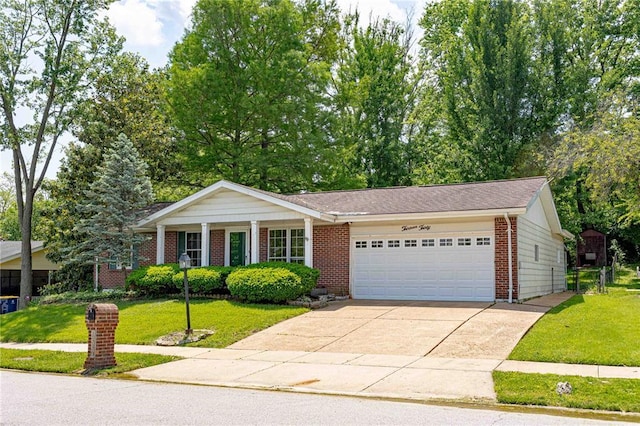 view of front of house with an attached garage, brick siding, and a front yard