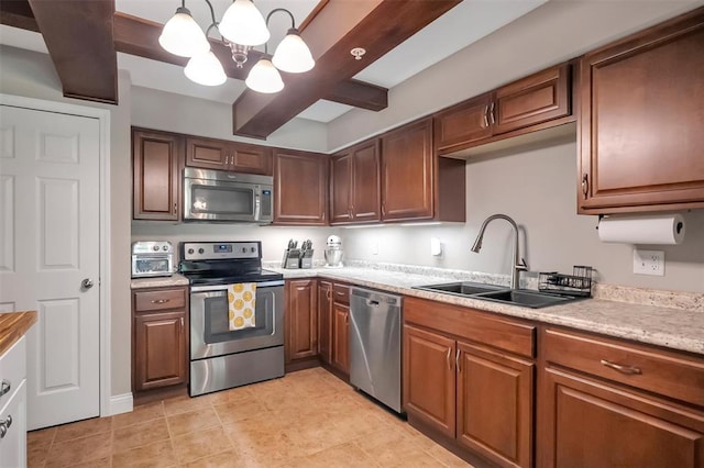 1408 Summertree Springs Ave Unit C, Valley Park, MO 63088 - kitchen with appliances with stainless steel finishes, a sink, a chandelier, light countertops, and light tile patterned floors