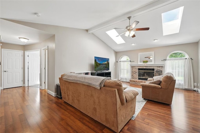14 Heavenly Valley Dr, Dardenne Prairie, MO 63368 - living area featuring a skylight, ceiling fan, dark wood finished floors, a fireplace, and baseboards
