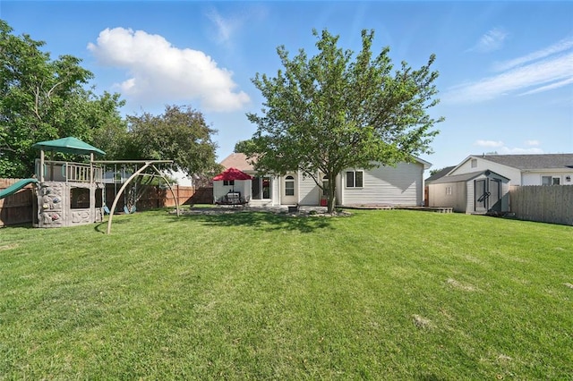 14 Heavenly Valley Dr, Dardenne Prairie, MO 63368 - view of yard with a playground, a shed, an outbuilding, and a patio