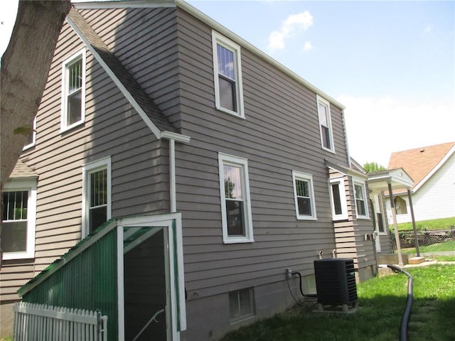 view of side of home featuring central air condition unit