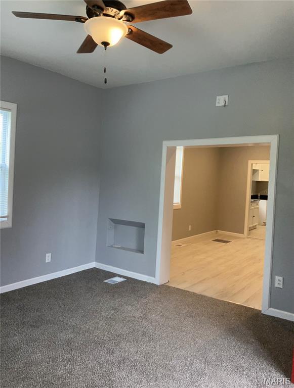 5379 Wabada Ave, Saint Louis, MO 63112 - empty room with carpet and a ceiling fan
