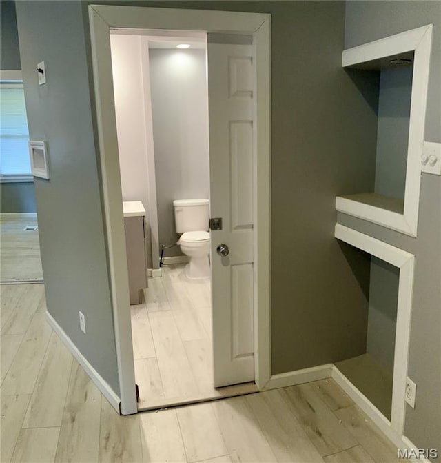 5379 Wabada Ave, Saint Louis, MO 63112 - bathroom with wood finished floors and vanity