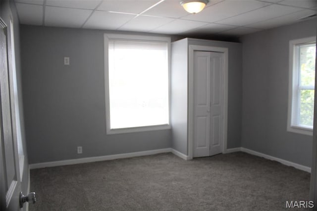 5379 Wabada Ave, Saint Louis, MO 63112 - unfurnished bedroom featuring carpet floors, a paneled ceiling, and a closet
