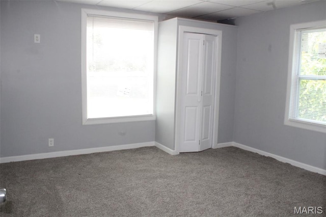 5379 Wabada Ave, Saint Louis, MO 63112 - unfurnished bedroom with carpet, a drop ceiling, and a closet