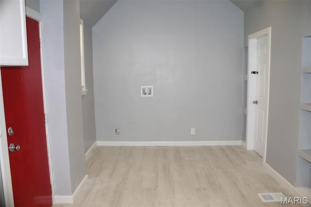 5379 Wabada Ave, Saint Louis, MO 63112 - spare room featuring light wood-style floors and vaulted ceiling