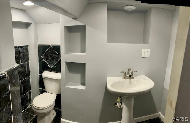 5379 Wabada Ave, Saint Louis, MO 63112 - half bathroom featuring toilet and tile walls