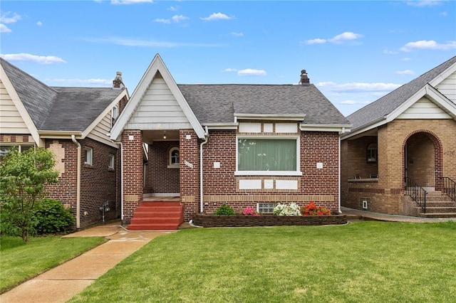 6266 Marmaduke Ave, Saint Louis, MO 63139 - english style home with brick siding, a front lawn, and roof with shingles