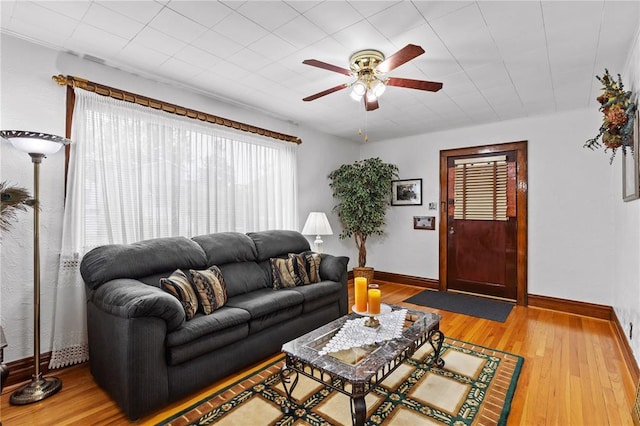 6266 Marmaduke Ave, Saint Louis, MO 63139 - living area featuring a ceiling fan, baseboards, and hardwood / wood-style floors