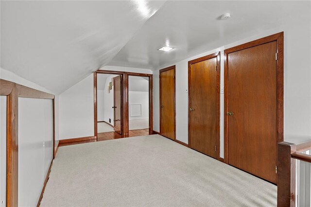 6266 Marmaduke Ave, Saint Louis, MO 63139 - additional living space with carpet floors, lofted ceiling, and baseboards
