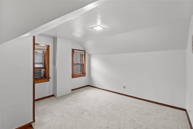 6266 Marmaduke Ave, Saint Louis, MO 63139 - additional living space with vaulted ceiling, carpet floors, and baseboards