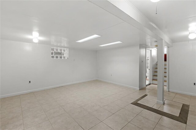6266 Marmaduke Ave, Saint Louis, MO 63139 - finished below grade area with stairs, tile patterned floors, and baseboards
