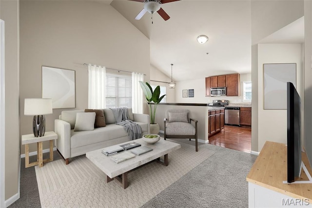 533 Bramblett Hls, Ofallon, MO 63366 - carpeted living room featuring high vaulted ceiling, plenty of natural light, a ceiling fan, and baseboards