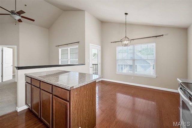 533 Bramblett Hls, Ofallon, MO 63366 - kitchen featuring brown cabinetry, stainless steel electric stove, ceiling fan, high vaulted ceiling, and dark wood-type flooring