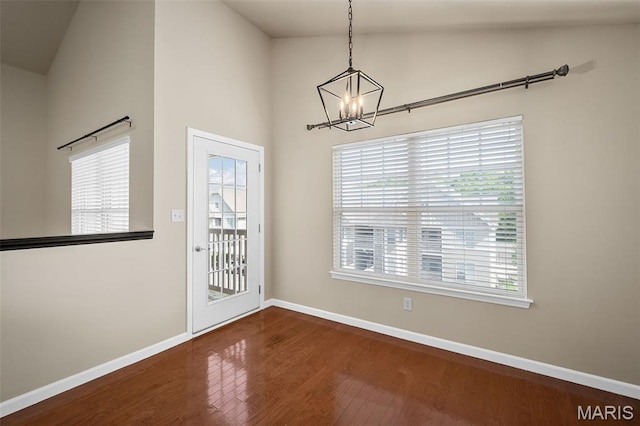 533 Bramblett Hls, Ofallon, MO 63366 - unfurnished dining area with a chandelier, wood finished floors, baseboards, and plenty of natural light