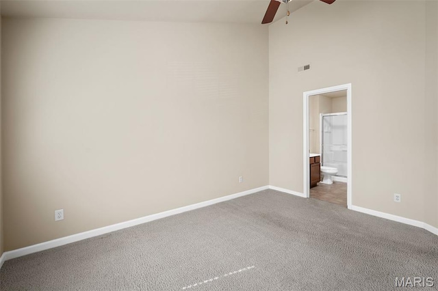 533 Bramblett Hls, Ofallon, MO 63366 - empty room with ceiling fan, baseboards, dark colored carpet, and high vaulted ceiling