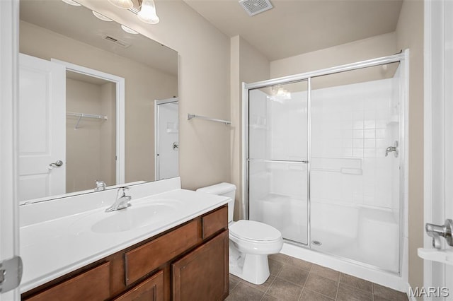 533 Bramblett Hls, Ofallon, MO 63366 - bathroom with a shower stall, vanity, toilet, and tile patterned flooring
