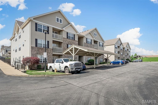 533 Bramblett Hls, Ofallon, MO 63366 - view of property with covered and uncovered parking and a residential view