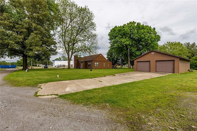 506 N Garfield, East Prairie, MO 63845 - view of grassy yard with a garage and an outbuilding