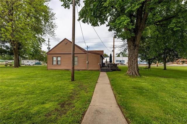 506 N Garfield, East Prairie, MO 63845 - view of side of property with a lawn and a deck