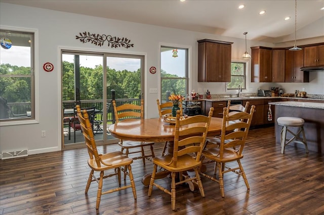 dining room featuring recessed lighting, dark wood finished floors, vaulted ceiling, and baseboards