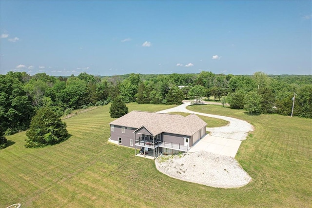 view of subject property with a heavily wooded area