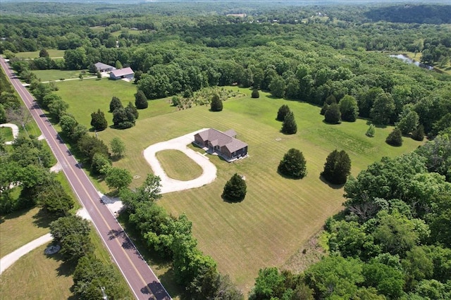 aerial view of sparsely populated area with a heavily wooded area