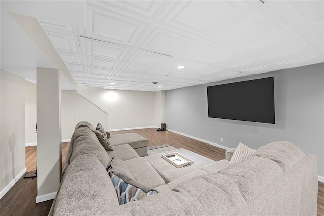 living area with wood finished floors, baseboards, recessed lighting, and an ornate ceiling