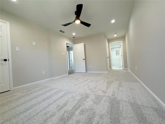 unfurnished bedroom featuring light colored carpet, baseboards, recessed lighting, and ceiling fan
