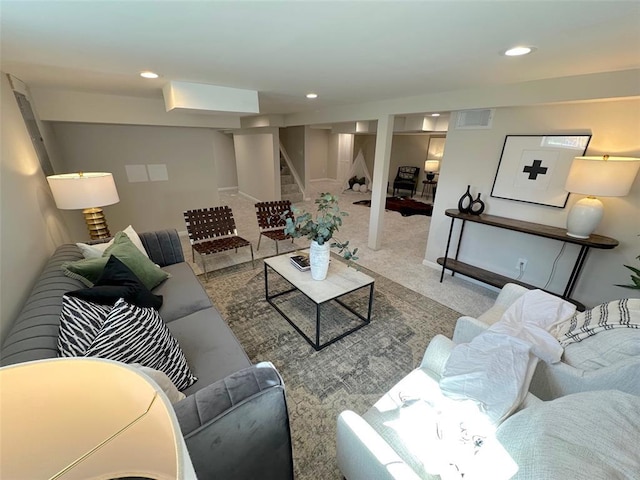 carpeted living room featuring stairs and recessed lighting