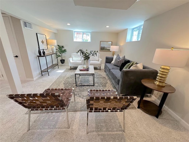 living area with carpet floors, plenty of natural light, baseboards, and recessed lighting