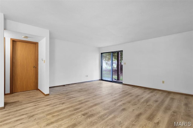 1380 Heritage Lndg Unit 105, Frontier Township, MO 63303 - empty room with light wood-type flooring and baseboards