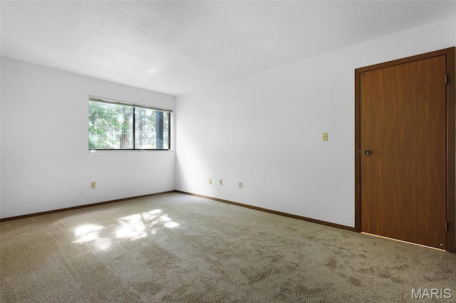 1380 Heritage Lndg Unit 105, Frontier Township, MO 63303 - spare room with carpet flooring, baseboards, and a textured ceiling