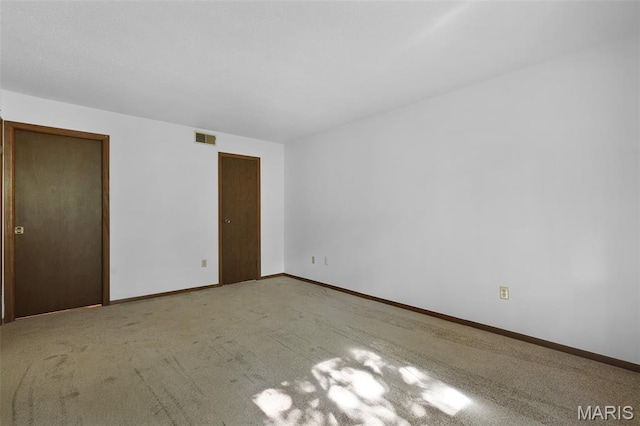 1380 Heritage Lndg Unit 105, Frontier Township, MO 63303 - unfurnished bedroom with baseboards and carpet flooring