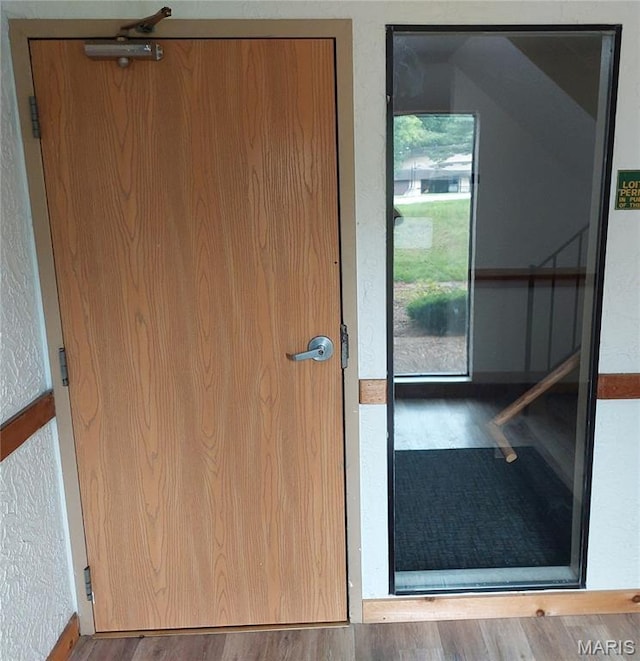 1380 Heritage Lndg Unit 105, Frontier Township, MO 63303 - entryway with wood finished floors