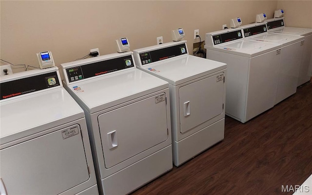 1380 Heritage Lndg Unit 105, Frontier Township, MO 63303 - community laundry featuring washing machine and clothes dryer and dark wood-type flooring