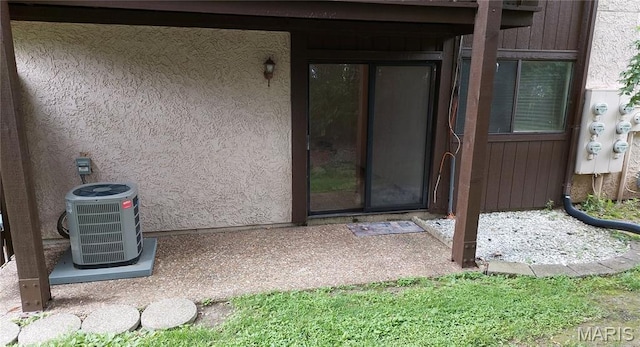 1380 Heritage Lndg Unit 105, Frontier Township, MO 63303 - property entrance with central AC and stucco siding