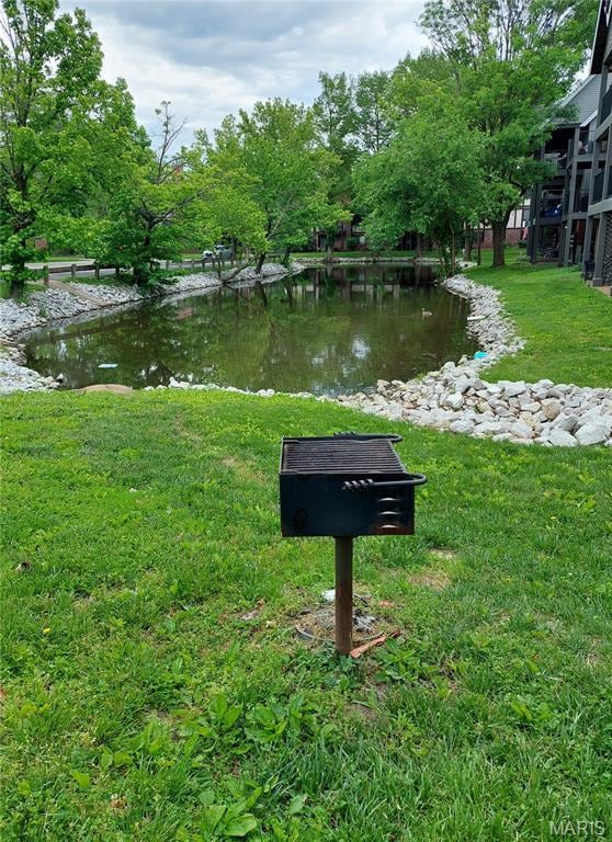 1380 Heritage Lndg Unit 105, Frontier Township, MO 63303 - view of property's community featuring a water view and a yard