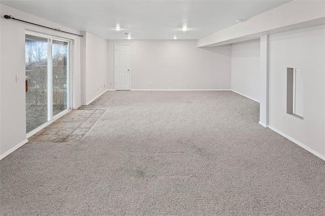 basement featuring carpet and baseboards