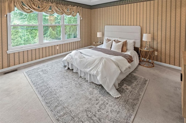 carpeted bedroom featuring baseboards