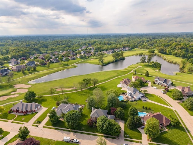 aerial perspective of suburban area with a golf club and a large body of water