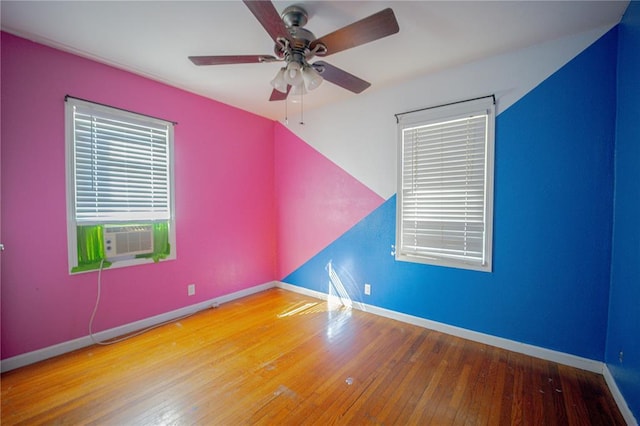 225 Haller Ave, East Alton, IL 62024 - unfurnished room featuring cooling unit, wood-type flooring, ceiling fan, and baseboards