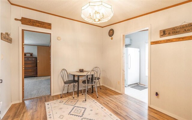 442 County Road 6250, Salem, MO 65560 - dining room with a chandelier, crown molding, wood finished floors, and a textured ceiling