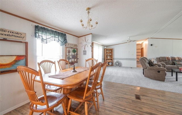 442 County Road 6250, Salem, MO 65560 - dining room featuring crown molding, a textured ceiling, wood finished floors, a chandelier, and ceiling fan