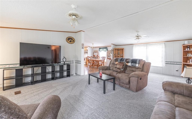442 County Road 6250, Salem, MO 65560 - carpeted living room with a ceiling fan, ornamental molding, and a textured ceiling
