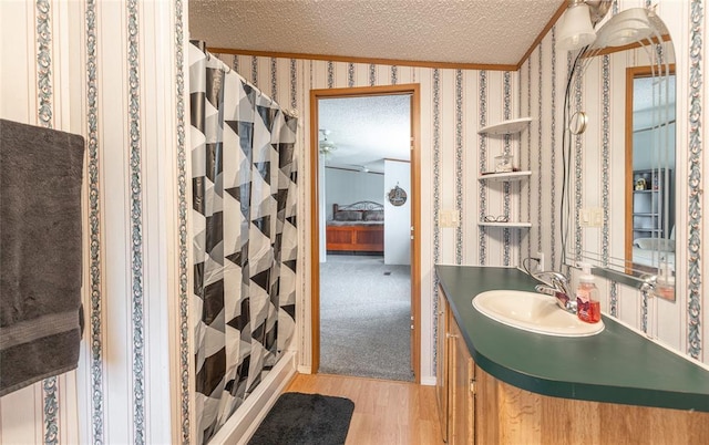 442 County Road 6250, Salem, MO 65560 - full bathroom featuring a textured ceiling, wood finished floors, a shower with shower curtain, vanity, and crown molding
